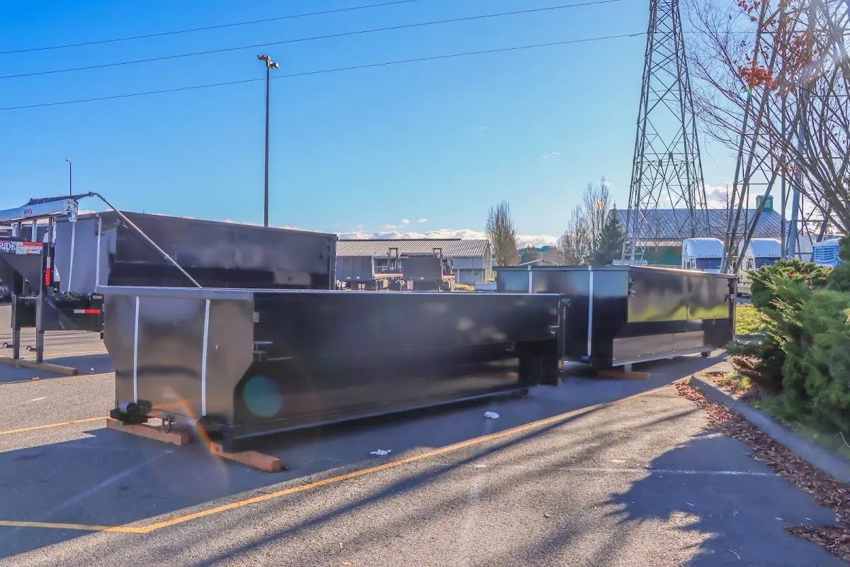 Roll-off dumpster ready for waste disposal at job site for 3 Yard Dumpster Rental in Three Lakes